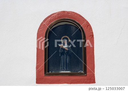 Saint Rita statue in a window of a church, Spain 125033007