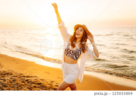 Happy woman on beach in summer style fashion trend outfit carefree and happy, feeling freedom. 125033804