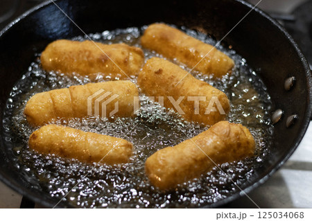 Fried cheese fingers, tequenos stuffed with white cheese Fried cheese fingers, tequenos stuffed with white cheese 125034068