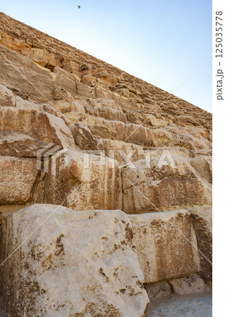 Steps of the Great Pyramid reveal ancient construction techniques and history during the day at Giza Steps of the Great Pyramid reveal ancient construction techniques and history during the day at Giza 125035778