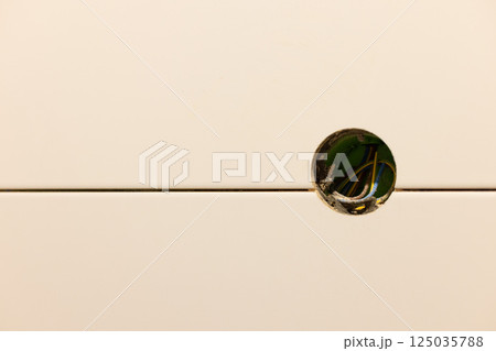 Electric sockets box in the tiled wall. Closeup 125035788