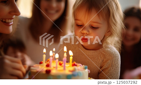 Happy Child Celebrating Birthday with Cake and Candles 125037292