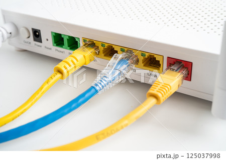 Ethernet cable with wireless router connect to internet service provider internet network. 125037998