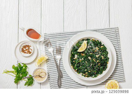 sauteed kale with garlic, onion, red pepper flakes sauteed kale with garlic, onion, red pepper flakes 125039898