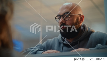 Man Giving Documents to Airline Agent, Verifying by Facial Recognition Scanning 125040643