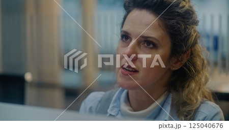 Close Up of Female Airline Worker Checking Documents and Airplane Ticket of Passenger Close Up of Female Airline Worker Checking Documents and Airplane Ticket of Passenger 125040676