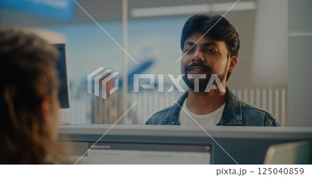 Airport Check-in Counter: Indian Man Verifying Biometric Data by Facial Recognition Scanning 125040859