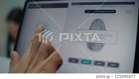 Check-in Counter: Close Up of Man Putting Finger on Touch Screen for Fingerprint Scanning 125040877