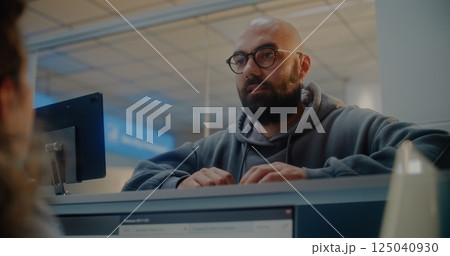 Female Airline Agent Checking Documents, Giving Passport and Boarding Pass to Passenger 125040930