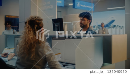 Airport Check-in Counter: Indian Man Verifying Personal ID Data by Facial Recognition Scanning 125040950