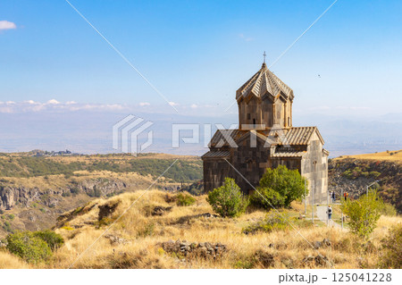 Famous view to ancient Vahramashen church of the 11th century, located near destroyed Amberd fortress in sunny summer day. Cliff with Arkashian River deep in canyon. Aragatsotn, Armenia Famous view to ancient Vahramashen church of the 11th century, located near destroyed Amberd fortress in sunny summer day. Cliff with Arkashian River deep in canyon. Aragatsotn, Armenia 125041228