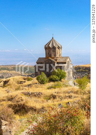 Aerial drone view of famous Vahramashen Church of the 11th century, located near destroyed Amberd fortress in sunny summer day. Cliff with Arkashian River deep in canyon. Aragatsotn region, Armenia Aerial drone view of famous Vahramashen Church of the 11th century, located near destroyed Amberd fortress in sunny summer day. Cliff with Arkashian River deep in canyon. Aragatsotn region, Armenia 125041229