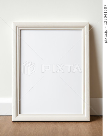 Blank picture frame on white wall background 125041507