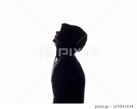person in Hood silhouette. Man in a hooded sweatshirt person in Hood silhouette. Man in a hooded sweatshirt 125041634