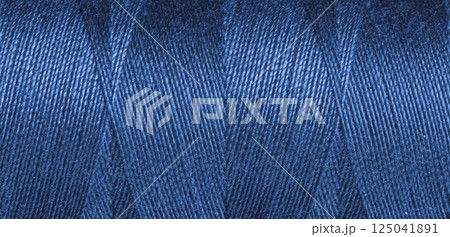 Blue sewing thread texture 125041891