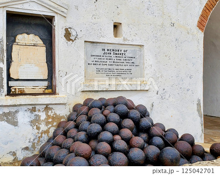 Elmina Castle Accra Ghana building and cannonballs Elmina Castle Accra Ghana building and cannonballs 125042701