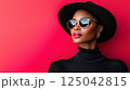 Beauty stylish portrait of fashion young African woman in hat, beautiful trendy model 125042815