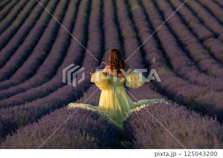 Lavender Fields Provence Woman: Yellow Dress photoshoot in French Lavender fields during summer showcasing beauty and serenity. Lavender Fields Provence Woman: Yellow Dress photoshoot in French Lavender fields during summer showcasing beauty and serenity. 125043200