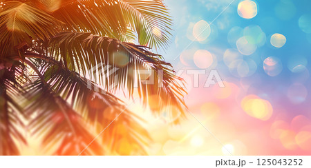 Palm Tree with Glowing Golden Bokeh Effect	 125043252