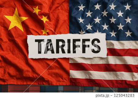 Torn paper with the word tariffs placed over USA and China flags, symbolizing rising trade tensions, barriers and economic conflicts 125043283