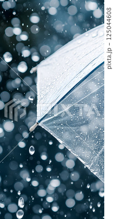 Close up, transparent umbrella under rainfall against a background of water droplets splashing. Concept of rainy weather. Close up, transparent umbrella under rainfall against a background of water droplets splashing. Concept of rainy weather. 125044608