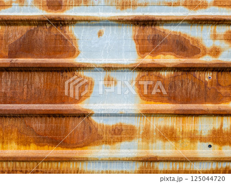 Rusty corrugated metal siding, weathered texture, industrial background 125044720