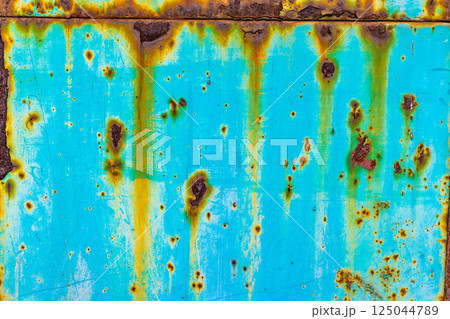 Aqua metal with rust drips and spots 125044789