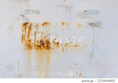 Worn white painted metal with rust and sticky tape residue Worn white painted metal with rust and sticky tape residue 125044802
