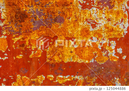 Flaking Red Paint on Rusty Metal 125044886