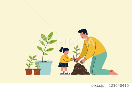 Father and Daughter Planting a Tree 125048410