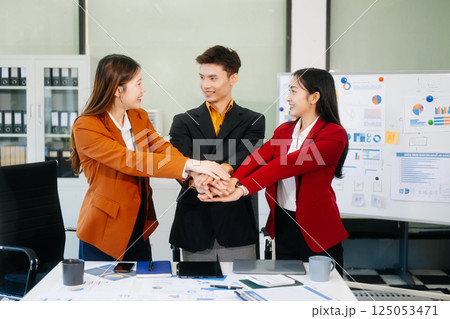 Office colleagues have a casual discussion. During a meeting in a conference room, a group of business teem Office colleagues have a casual discussion. During a meeting in a conference room, a group of business teem 125053471