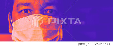 Closeup of man in mask in vivid neon hues Closeup of man in mask in vivid neon hues 125058654