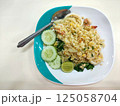 Seafood fried rice on a plate with a spoon 125058704