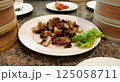 Fried pork from Trang Province, Thailand, placed on a plate on the dining table. 125058711