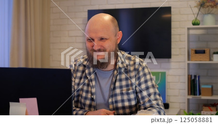 Professional man handling work and personal calls, multitasking evident in focused expression, multitasking essential for modern lifestyles, ideal for business and lifestyle videos. 125058881