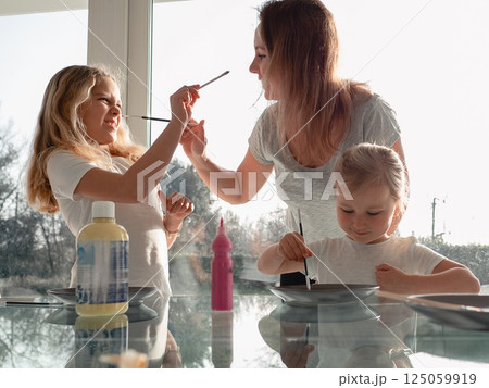 Family Painting Fun with Kids and Paintbrushes Family Painting Fun with Kids and Paintbrushes 125059919