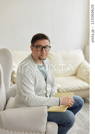 Portrait of handsome male psychologist 125060620
