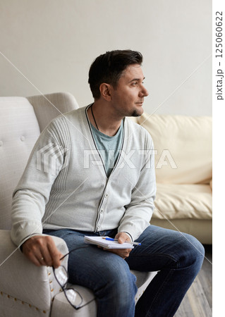 Portrait of handsome male psychologist 125060622