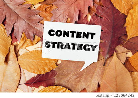 White sign with the word content strategy White sign with the word content strategy 125064242