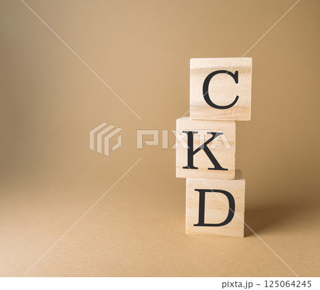 Three wooden blocks stacked on top of each other, with the letters CKD 125064245