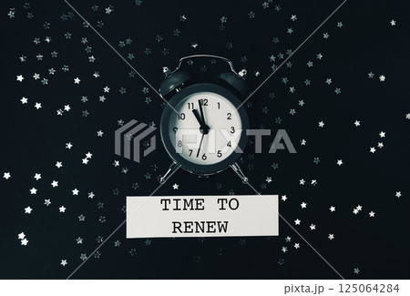Black and white photo of a clock with the words Time to Renew written below Black and white photo of a clock with the words Time to Renew written below 125064284