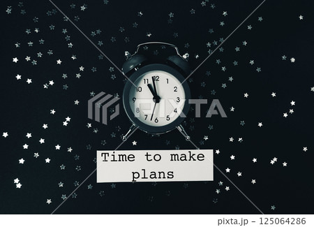 Black and white photo of a clock with the words Time to make plans 125064286