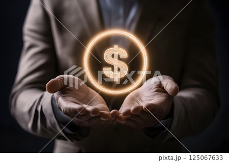 businessman's hands hold a glowing American dollar sign, finance, taxes, income 125067633