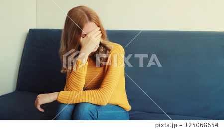Upset sad crying woman while experiencing mental suffering, depression, fatigue, emotional stress 125068654