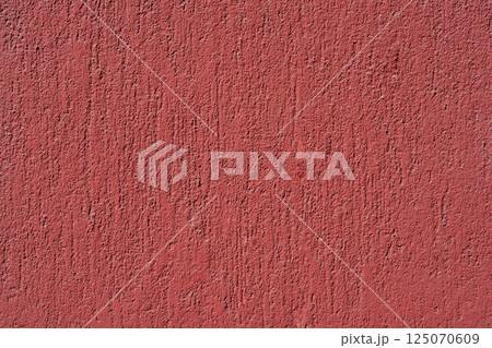 Textured red wall 125070609