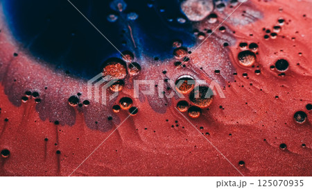 Paint background. Sparkling fluid. Defocused blue red bronze color ink in water chemical liquid oil drop leaking on creative abstraction. Paint background. Sparkling fluid. Defocused blue red bronze color ink in water chemical liquid oil drop leaking on creative abstraction. 125070935