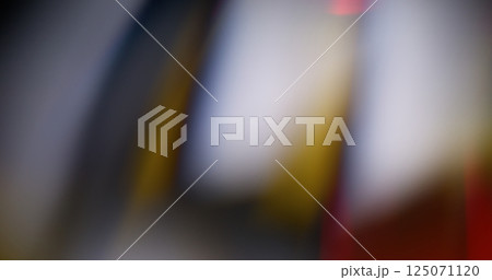 Laser effect. Blur glow. Defocused white yellow crimson color lens flare shine sparks on abstract dark black background. 125071120