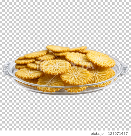 Ghevar crispy and disc shaped in a clear glass tray three quarter 125071457