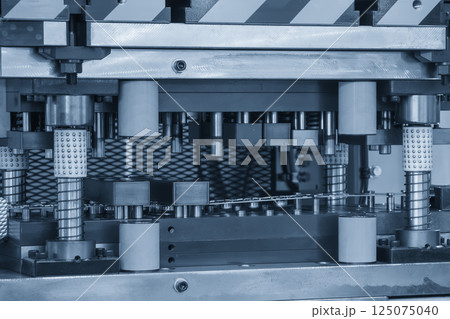 The metal forming process by progressive die in the light blue scene. 125075040