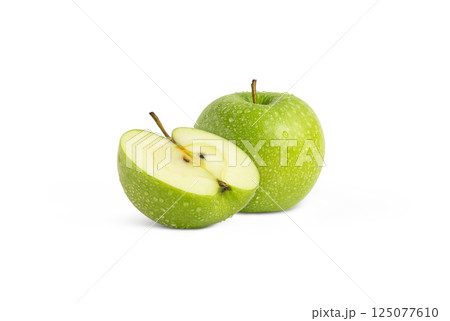 Fresh green apple with water droplets and a half isolated  125077610